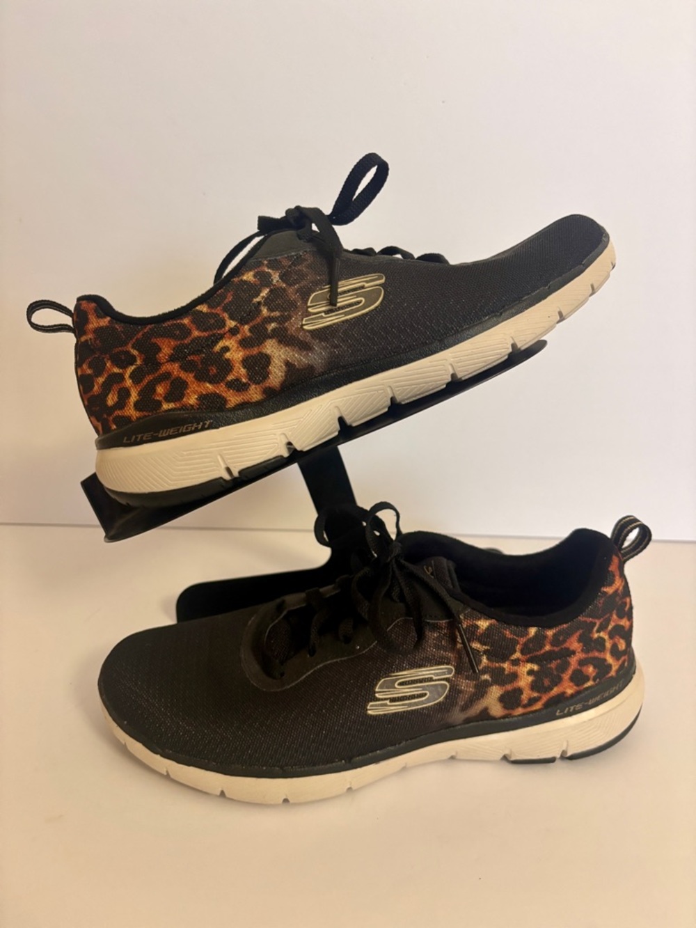 Skechers Women's Black and Leopard Print Slip-On Athletic Sneakers